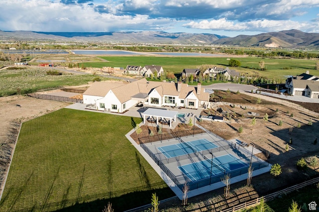 view of subject property with a water and mountain view