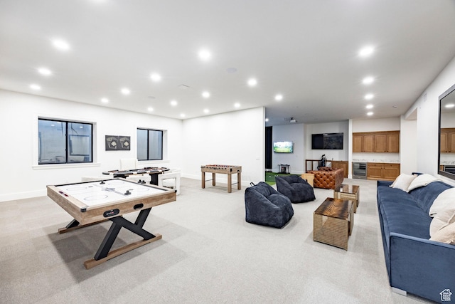 rec room featuring beverage cooler, recessed lighting, light colored carpet, and baseboards