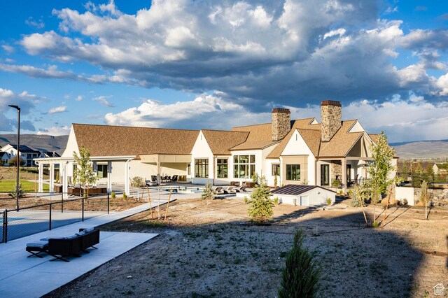 618 S Fox Den Rd Unit 2, Midway, UT 84049 - back of property featuring a chimney, a patio, and stucco siding