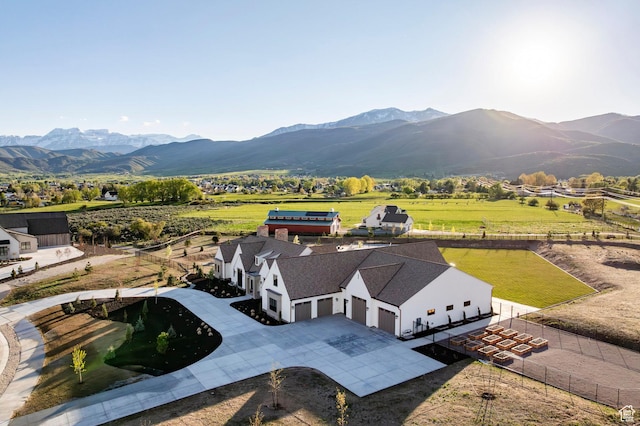 view of subject property with a mountain backdrop