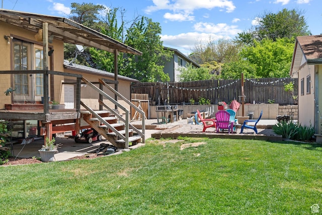 view of yard featuring a patio and stairway