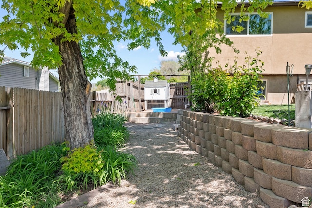 view of property's community featuring fence