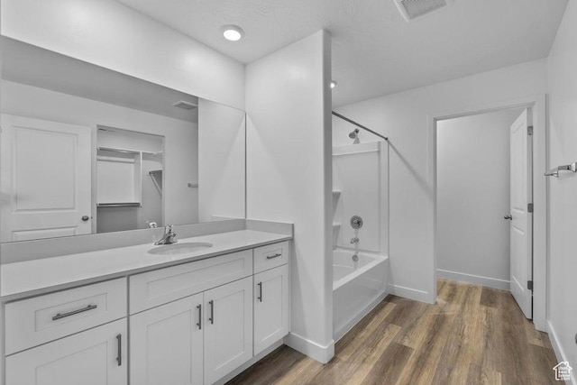 1448 S Staircase Way Unit 4099, Washington, UT 84780 - full bath with wood finished floors, vanity, bathtub / shower combination, and baseboards