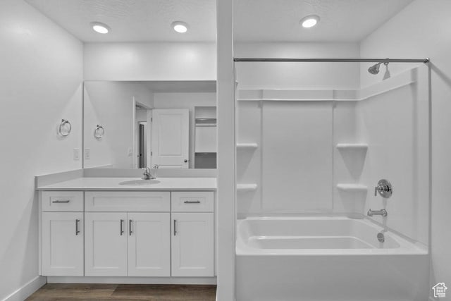 1448 S Staircase Way Unit 4099, Washington, UT 84780 - bathroom featuring  shower combination, wood finished floors, vanity, and baseboards