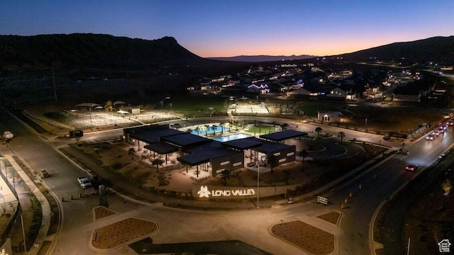 1448 S Staircase Way Unit 4099, Washington, UT 84780 - aerial view at dusk of a mountain view and view of pool area