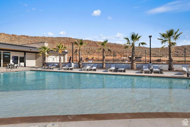 1448 S Staircase Way Unit 4099, Washington, UT 84780 - community pool featuring a patio area, fence, and a mountain view