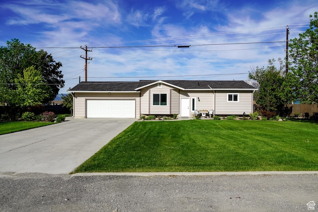 ranch-style home with concrete driveway and an attached garage