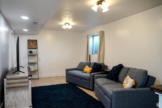 living area with light tile patterned flooring and baseboards