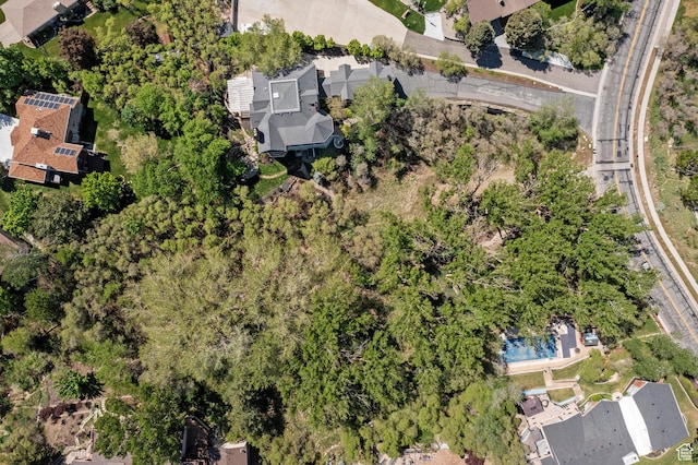 view of property location with a pool area and nearby suburban area