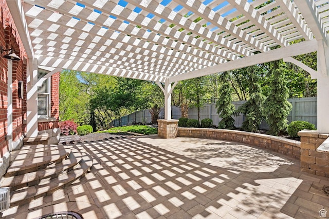 view of patio / terrace featuring a fenced backyard and a pergola