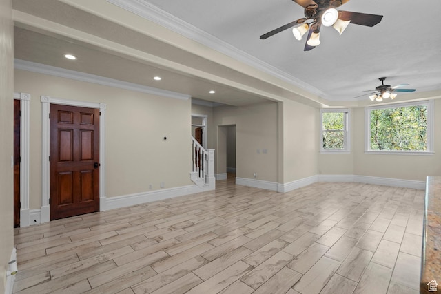 empty room with a ceiling fan, light wood-type flooring, stairs, crown molding, and recessed lighting