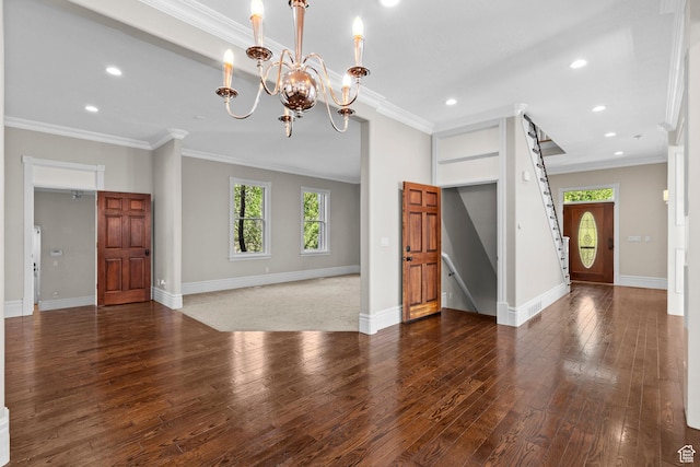 unfurnished living room featuring hardwood / wood-style floors, a chandelier, recessed lighting, baseboards, and ornamental molding