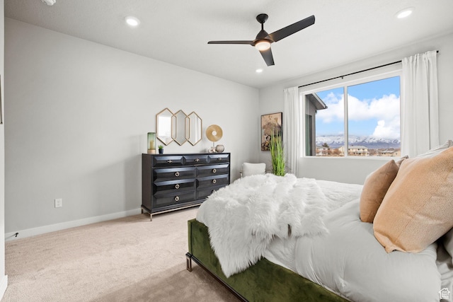 carpeted bedroom featuring baseboards, recessed lighting, and a ceiling fan