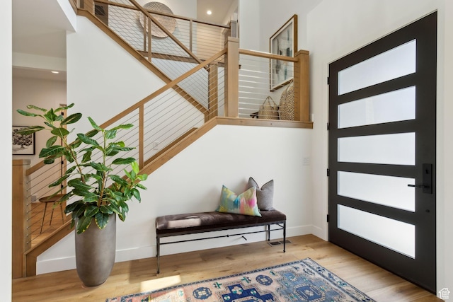 entryway featuring wood finished floors and baseboards