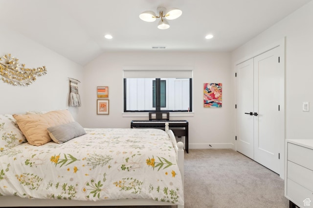 bedroom featuring light carpet, recessed lighting, lofted ceiling, a closet, and baseboards