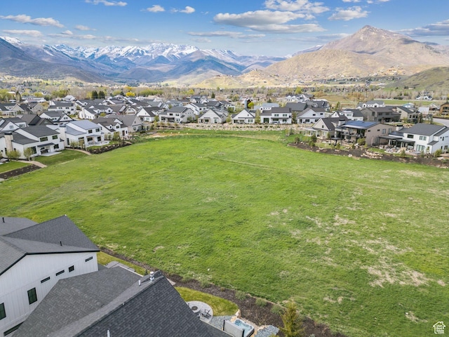 aerial view of residential area featuring mountains