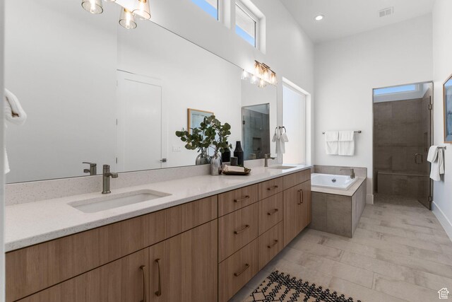 1526 S Shale Dr, St George, UT 84790 - bathroom featuring double vanity, a stall shower, a bath, and recessed lighting