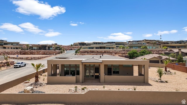 1526 S Shale Dr, St George, UT 84790 - back of house featuring stucco siding, fence, and a residential view