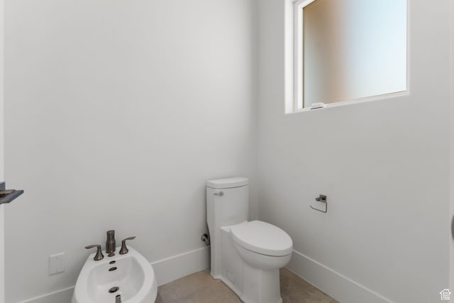 1526 S Shale Dr, St George, UT 84790 - bathroom with toilet, baseboards, tile patterned floors, and a bidet