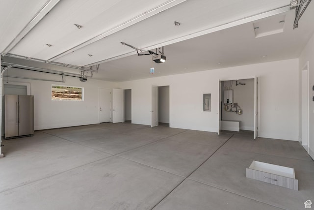 1526 S Shale Dr, St George, UT 84790 - garage with freestanding refrigerator, a garage door opener, and electric panel