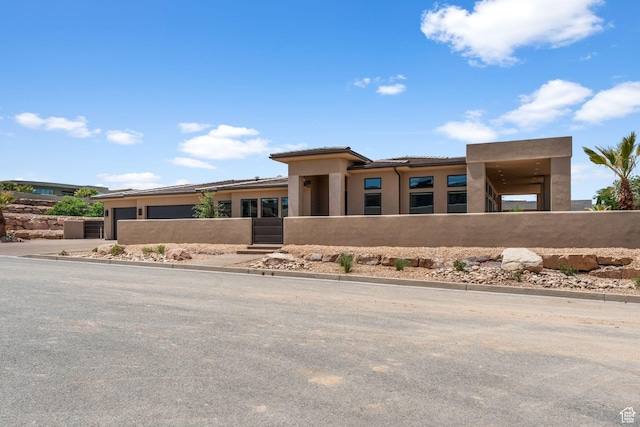 1526 S Shale Dr, St George, UT 84790 - view of front of home with an attached garage, stucco siding, and a tile roof
