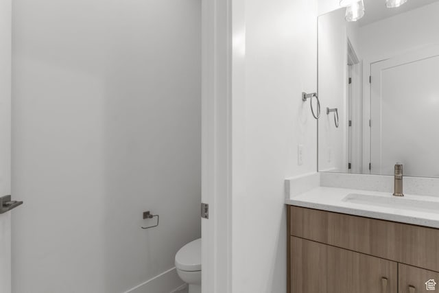 1526 S Shale Dr, St George, UT 84790 - bathroom with vanity, toilet, and baseboards