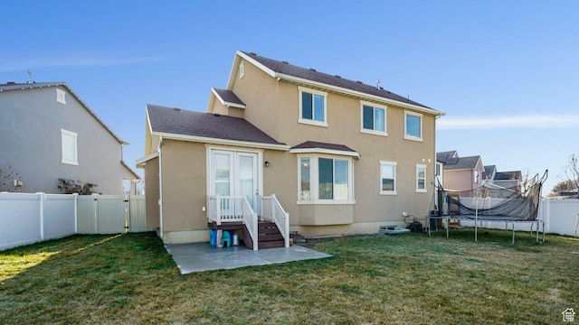 186 W 380 S, American Fork, UT 84003 - rear view of property with a trampoline, stucco siding, and a gate