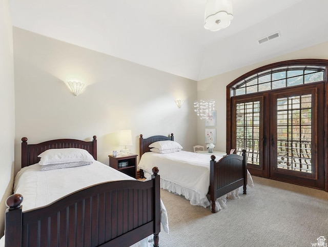 bedroom with carpet flooring, access to exterior, and lofted ceiling