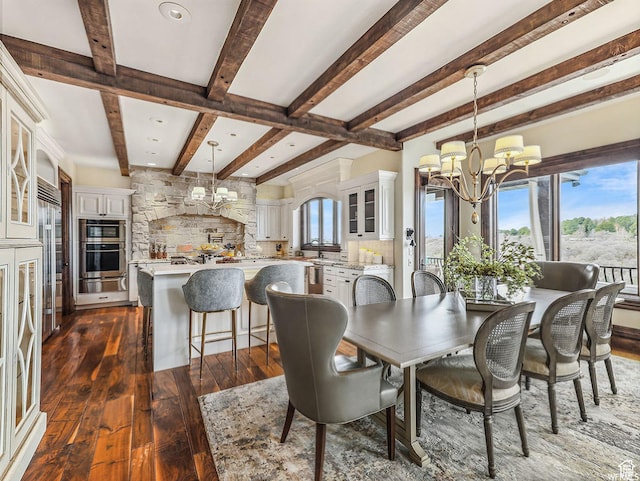 dining space with a chandelier, beam ceiling, dark wood-type flooring, plenty of natural light, and recessed lighting