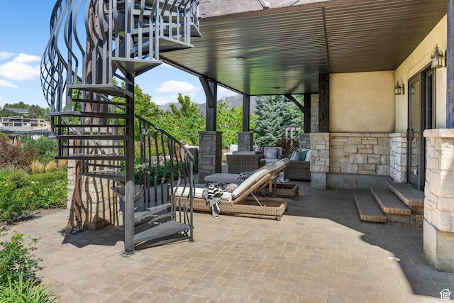 view of patio / terrace featuring stairs