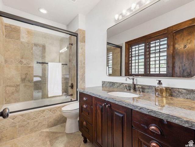 full bathroom featuring vanity, tiled shower / bath combo, toilet, tile patterned flooring, and recessed lighting