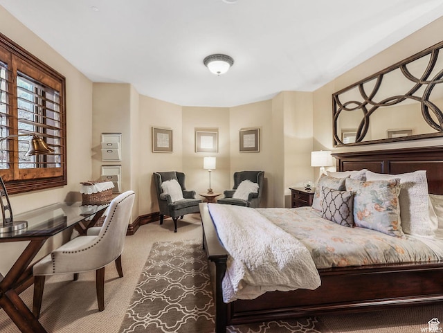 bedroom featuring carpet floors and baseboards