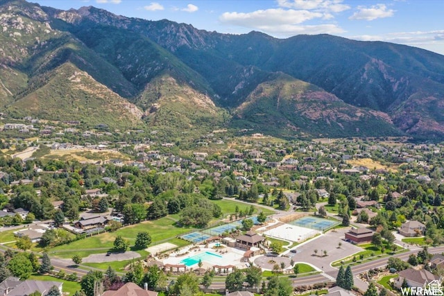 aerial view of a pool area and a mountainous background