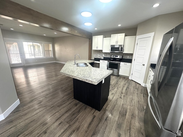 5516 W Florence Ln N, Highland, UT 84003 - kitchen featuring appliances with stainless steel finishes, dark wood-type flooring, white cabinets, backsplash, and recessed lighting