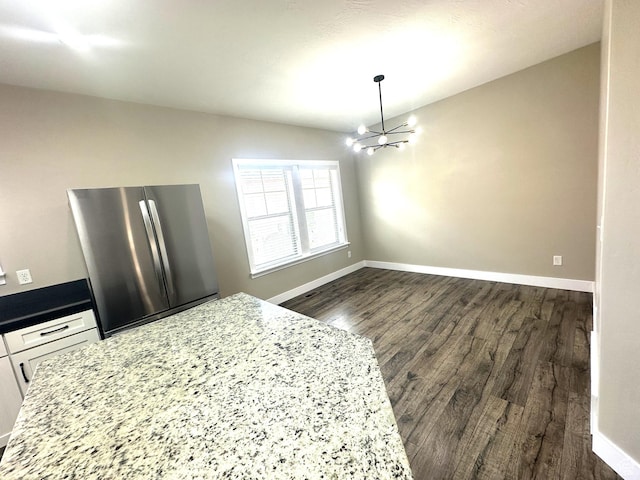 5516 W Florence Ln N, Highland, UT 84003 - unfurnished dining area with a chandelier and dark wood-style floors