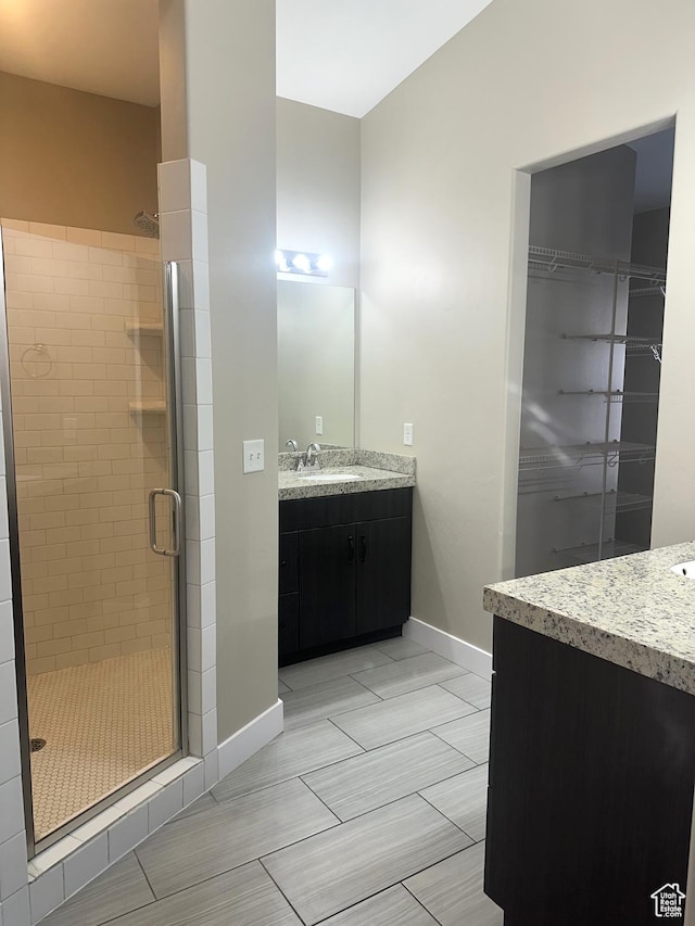 5516 W Florence Ln N, Highland, UT 84003 - bathroom with vanity, a shower stall, and a walk in closet