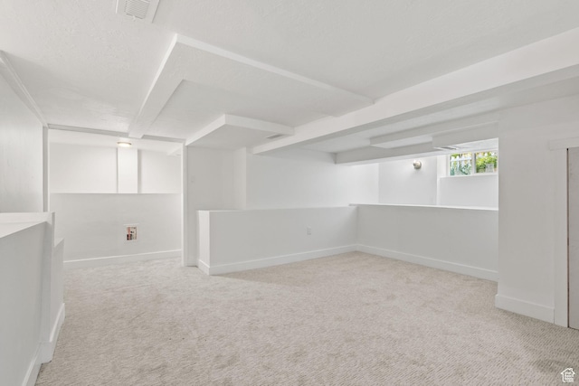 basement featuring carpet floors and baseboards