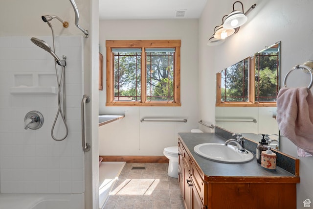 full bathroom featuring a shower, vanity, baseboards, tile patterned flooring, and toilet