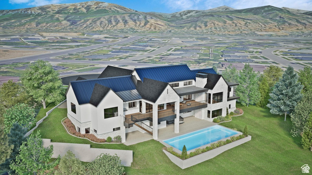aerial view of property and surrounding area with a mountainous background