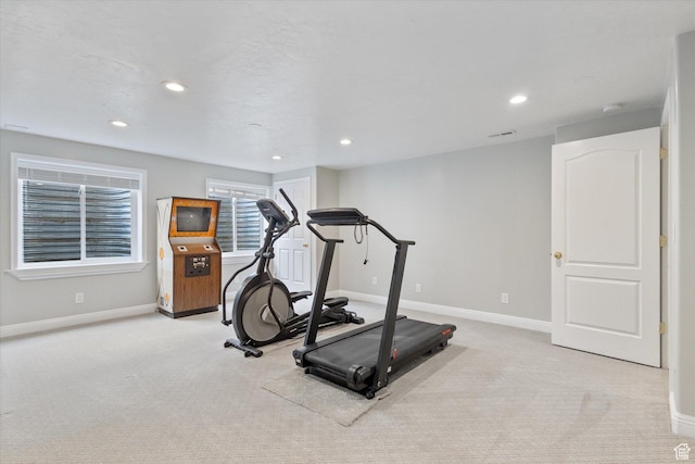 exercise area with carpet flooring, baseboards, and recessed lighting