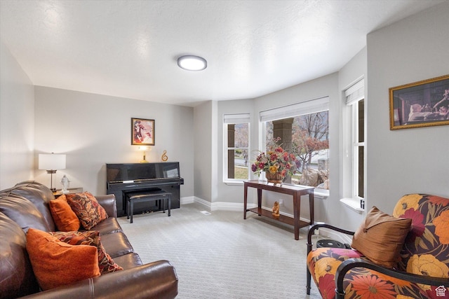 living room featuring light carpet and baseboards