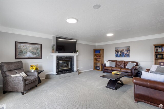 carpeted living room featuring ornamental molding, a fireplace, baseboards, recessed lighting, and a textured ceiling