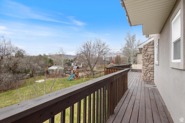 wooden deck with a playground