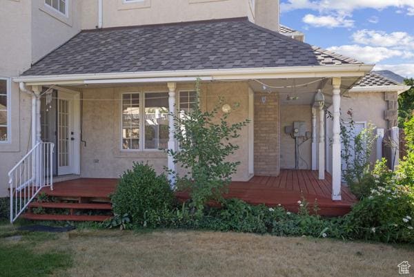 441 N Palisades Dr, Orem, UT 84097 - view of exterior entry featuring stucco siding, a porch, and a shingled roof