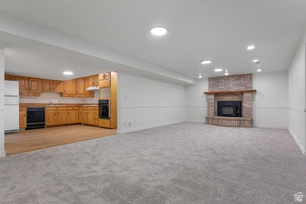 441 N Palisades Dr, Orem, UT 84097 - unfurnished living room with light colored carpet, a fireplace, and recessed lighting