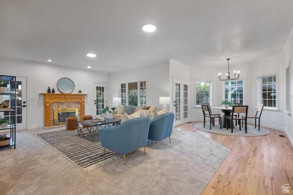 441 N Palisades Dr, Orem, UT 84097 - living area featuring a chandelier, a brick fireplace, recessed lighting, french doors, and wood finished floors