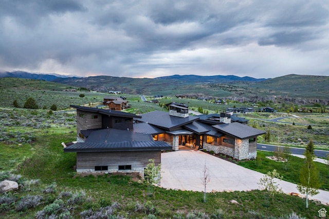 6110 E Blue Wing Loop, Kamas, UT 84036 - view of front of home featuring a chimney, a mountain view, metal roof, a standing seam roof, and driveway