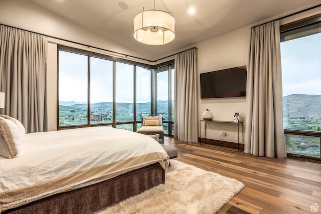 6110 E Blue Wing Loop, Kamas, UT 84036 - bedroom featuring wood finished floors, lofted ceiling, and recessed lighting