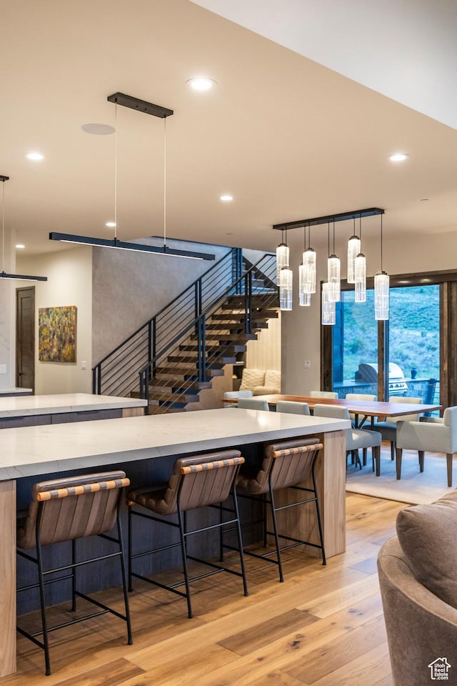 6110 E Blue Wing Loop, Kamas, UT 84036 - dining area featuring light wood-style floors, stairway, and recessed lighting