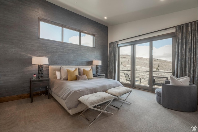 bedroom featuring access to outside, carpet flooring, multiple windows, and recessed lighting